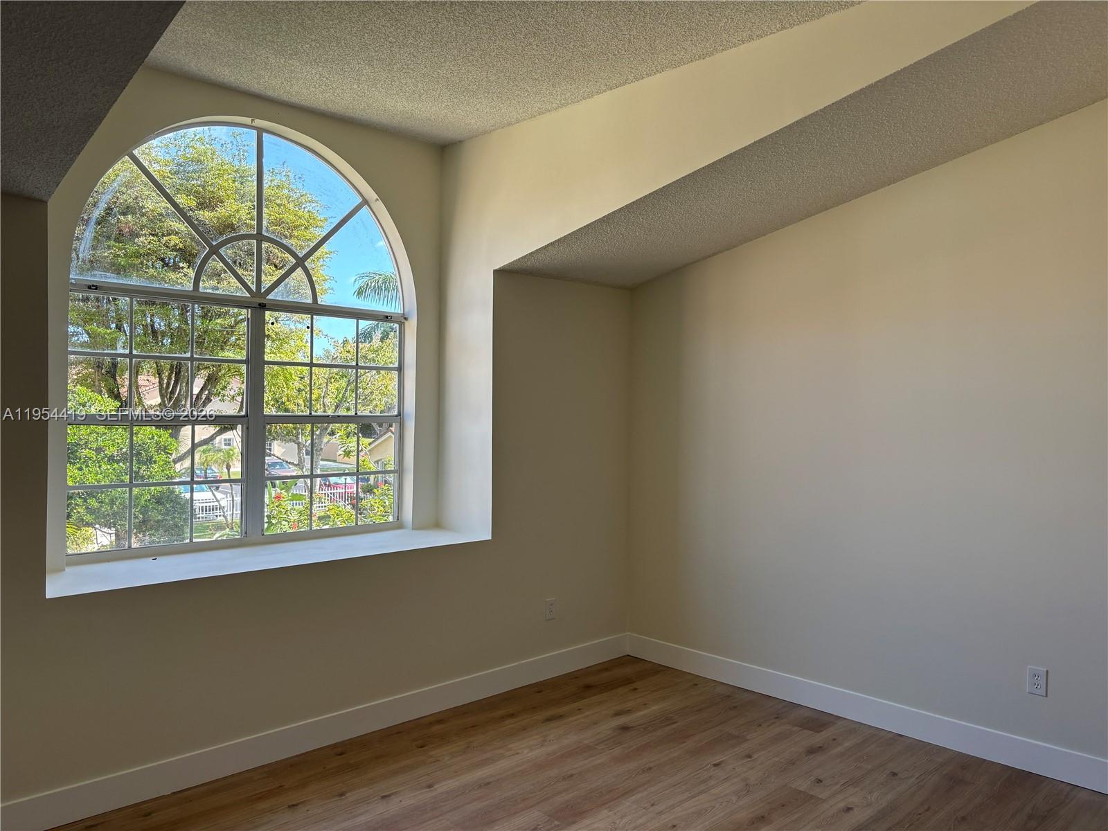 11132 Southwest 153rd Court Miami, FL 33196 - Photo 16 of 33 an empty room with a window