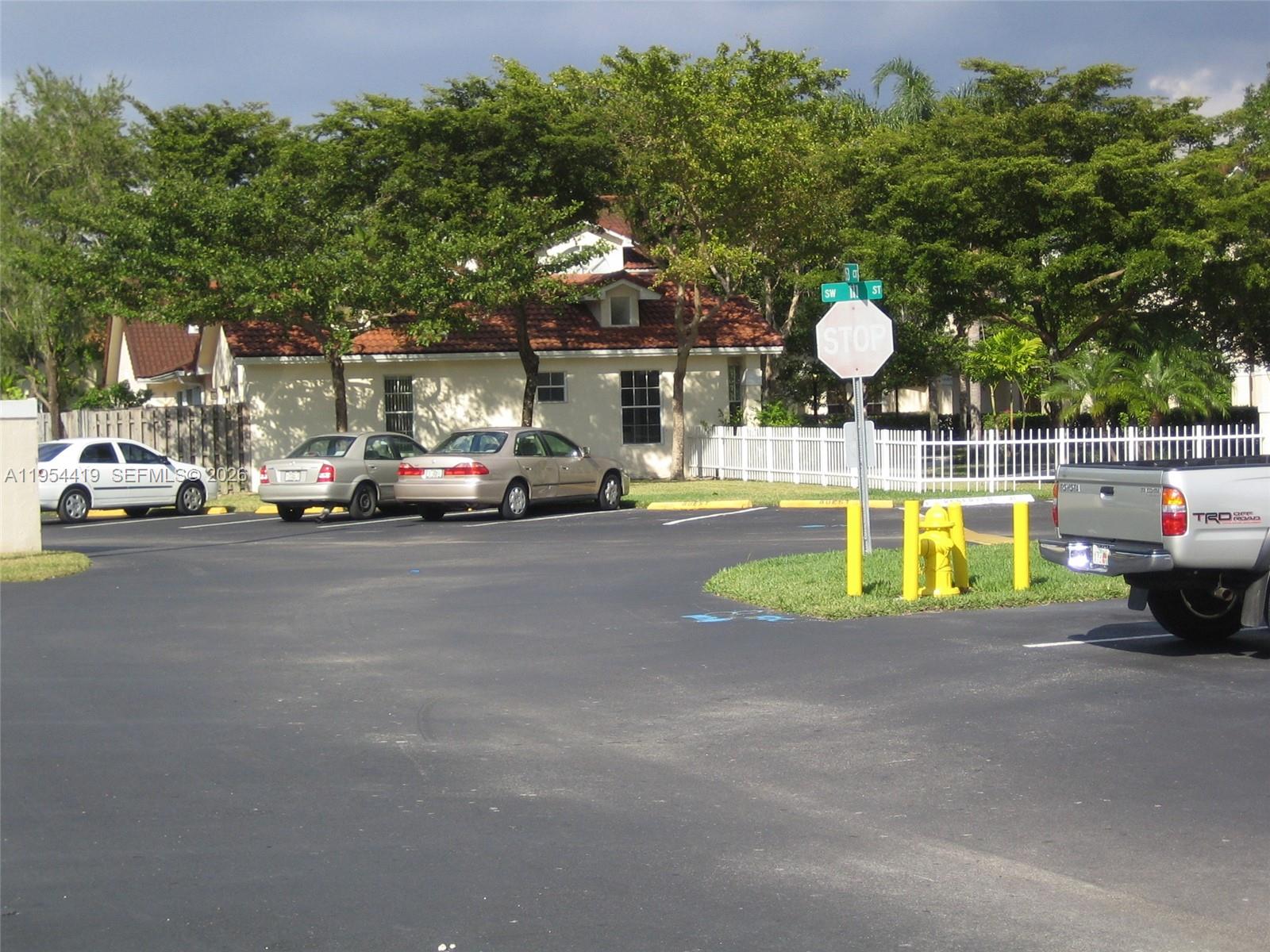 11132 Southwest 153rd Court Miami, FL 33196 - Photo 23 of 33 a view of a street with houses
