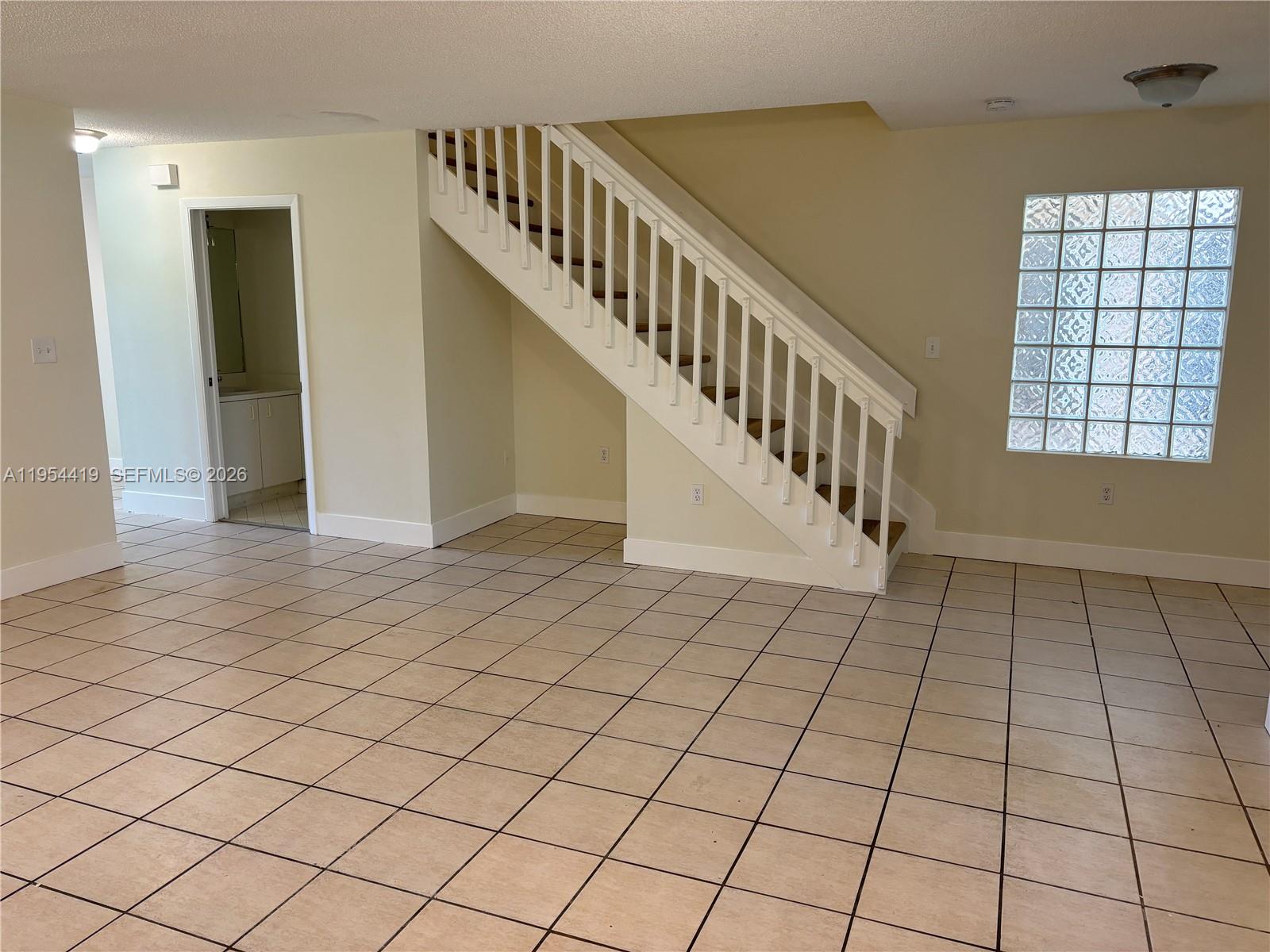 11132 Southwest 153rd Court Miami, FL 33196 - Photo 4 of 33 a view of an entryway with staircase