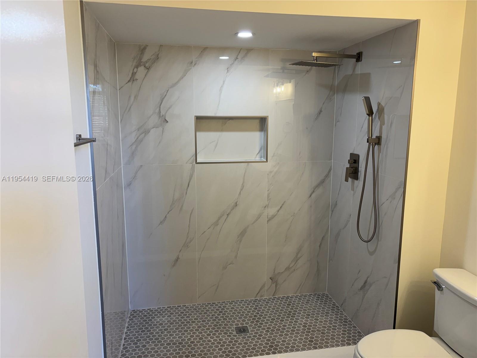 11132 Southwest 153rd Court Miami, FL 33196 - Photo 10 of 33 a bathroom with a shower