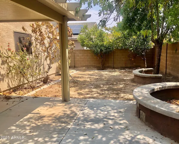 a backyard of a house with lots of green space