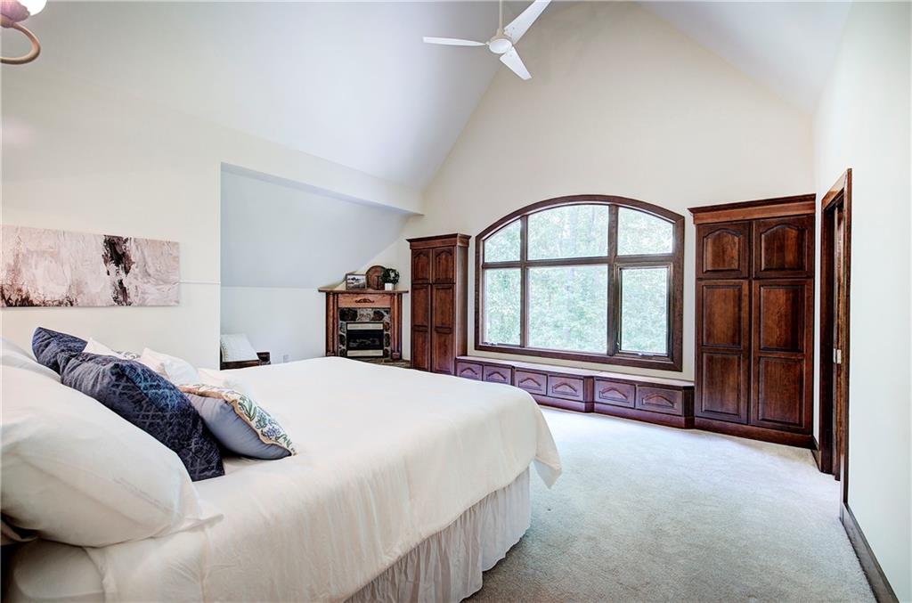260 Road 2 S Southwest Cartersville, GA 30120 - Photo 29 of 69 a spacious bedroom with a large bed and a large window