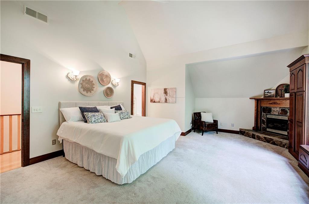 260 Road 2 S Southwest Cartersville, GA 30120 - Photo 30 of 69 a spacious bedroom with a bed and a television