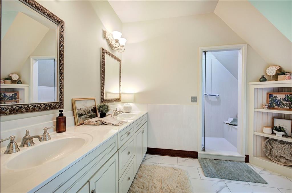 260 Road 2 S Southwest Cartersville, GA 30120 - Photo 32 of 69 a bathroom with a double vanity sink a shower and a mirror