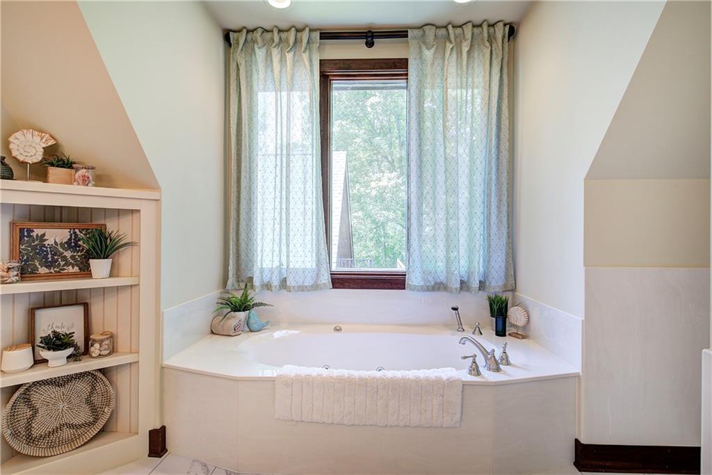 260 Road 2 S Southwest Cartersville, GA 30120 - Photo 34 of 69 a bath tub sitting in a bathroom next to a window