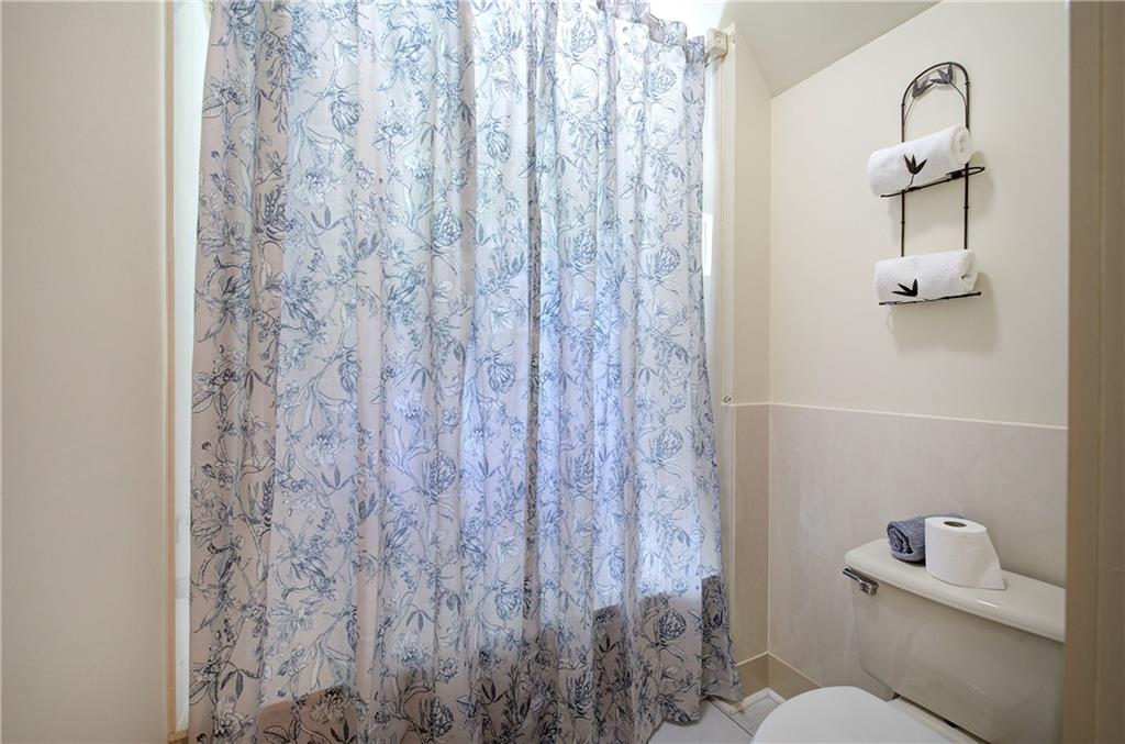 260 Road 2 S Southwest Cartersville, GA 30120 - Photo 42 of 69 a bathroom with a toilet and a shower curtain