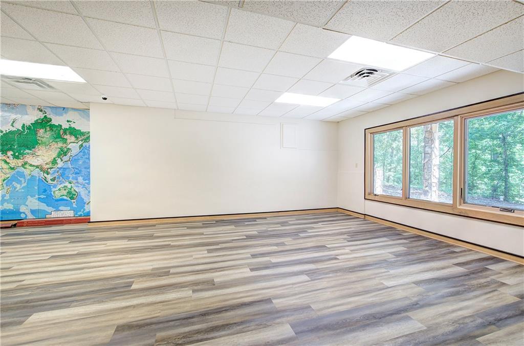 260 Road 2 S Southwest Cartersville, GA 30120 - Photo 47 of 69 a view of an empty room with a window and wooden floor