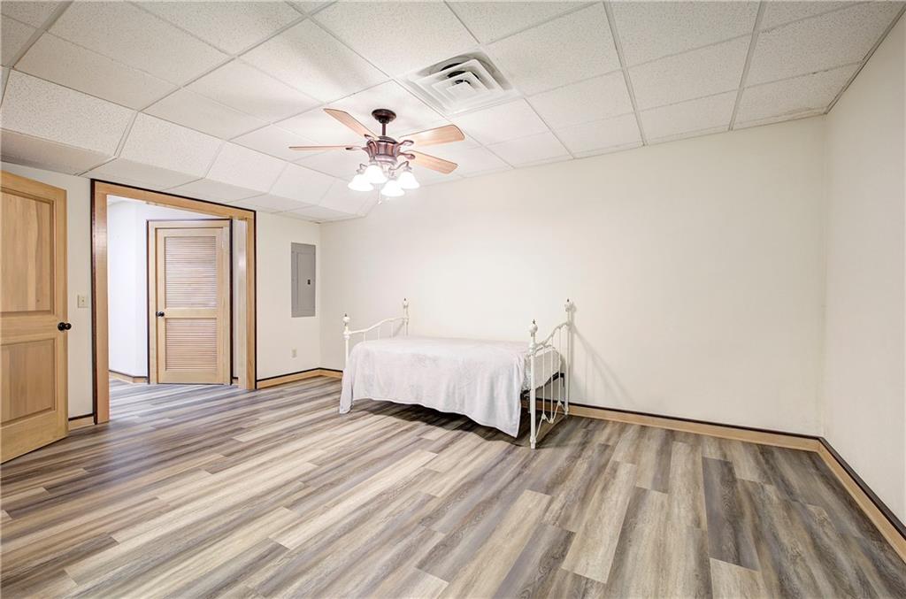 260 Road 2 S Southwest Cartersville, GA 30120 - Photo 49 of 69 a spacious bedroom with a bed and a ceiling fan