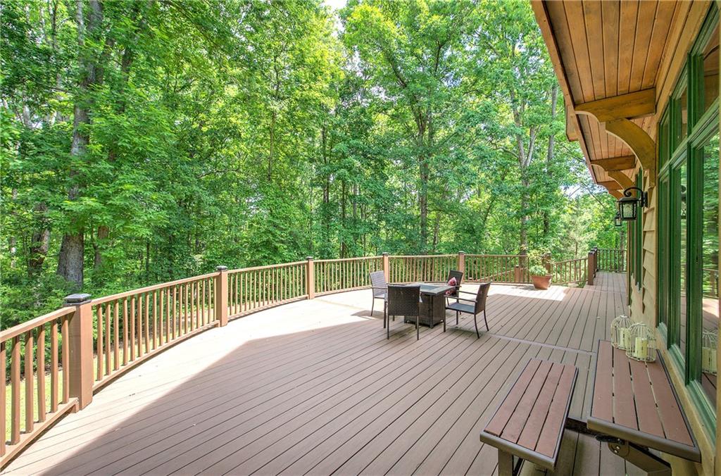 260 Road 2 S Southwest Cartersville, GA 30120 - Photo 56 of 69 a view of a roof deck with table and chairs with wooden floor and fence