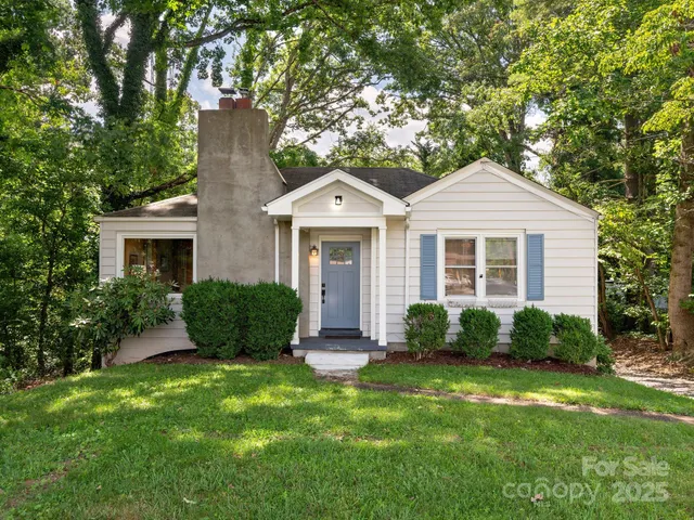 a front view of a house with a yard and porch