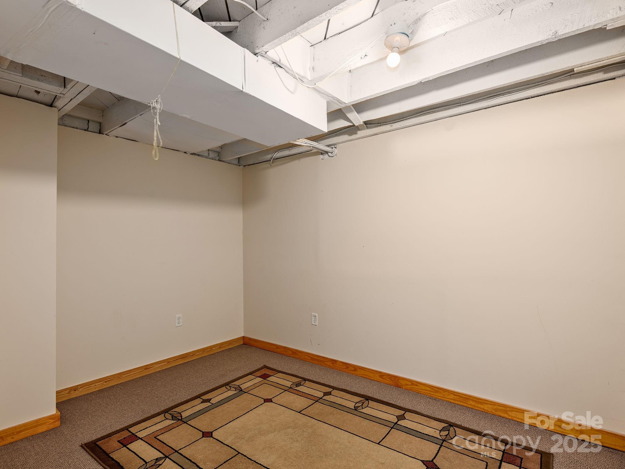 915 Tunnel Road Asheville, NC 28805 - Photo 17 of 22 a view of a room with racks on the wall