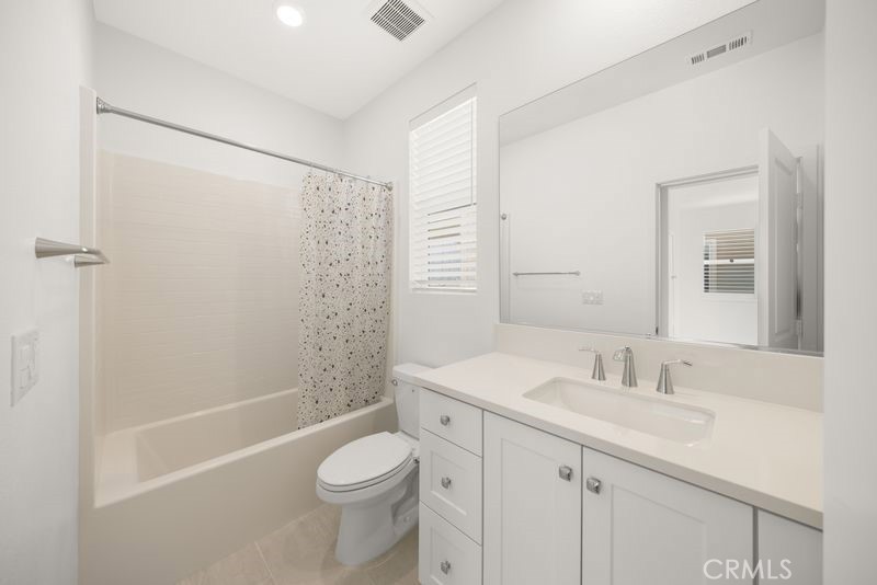 112 Junco Irvine, CA 92618 - Photo 14 of 17 a bathroom with a sink a toilet and shower