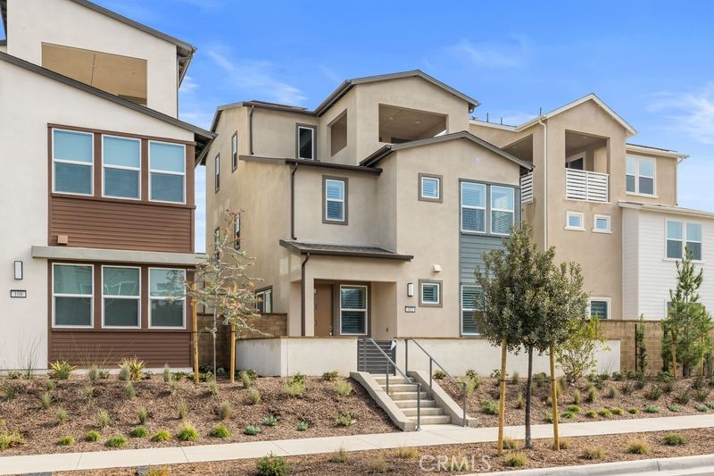 112 Junco Irvine, CA 92618 - Photo 2 of 17 a front view of a house with a yard