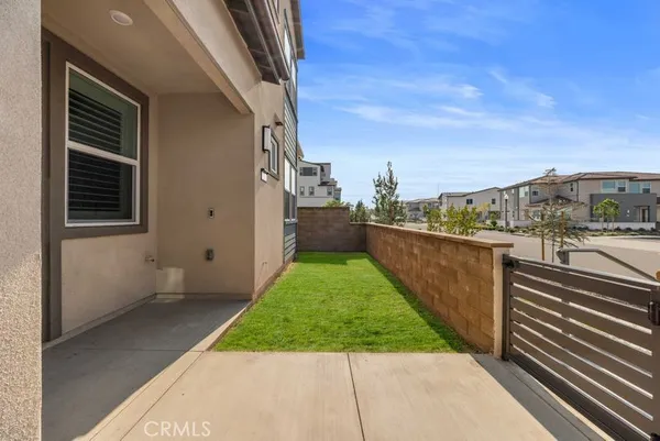 a view of a balcony with yard