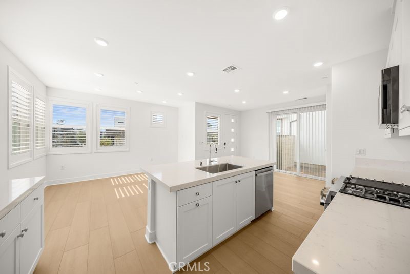 112 Junco Irvine, CA 92618 - Photo 6 of 17 a large bathroom with a large mirror vanity and a sink