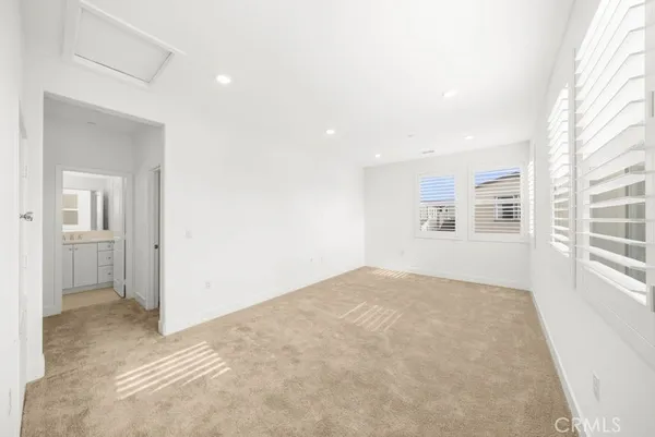 a view of empty room with windows