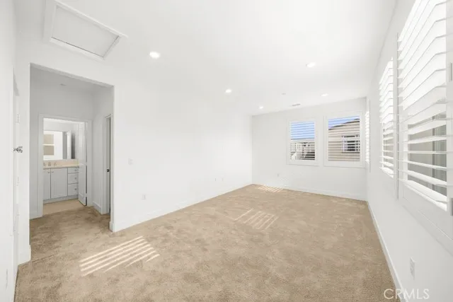 a view of empty room with windows