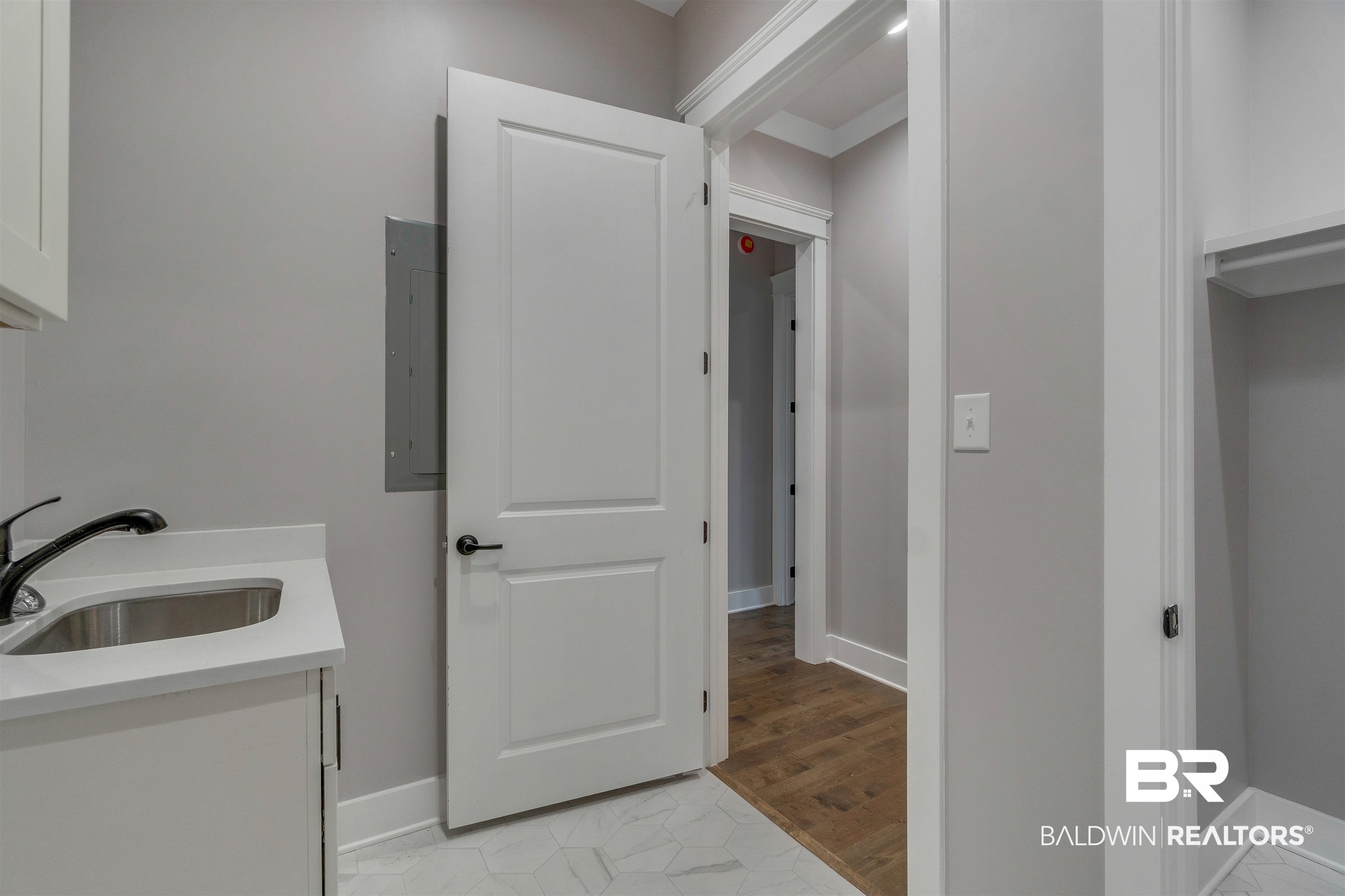 10985 Atrium Avenue Fairhope, AL 36532 - Photo 32 of 58 Bathroom with vanity, electric panel, and light tile patterned floors
