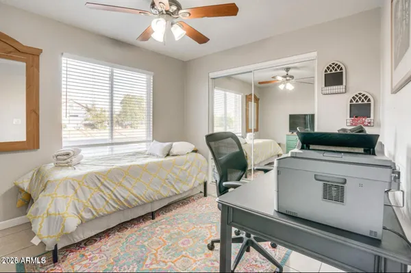 a bed room with a bed and a chandelier