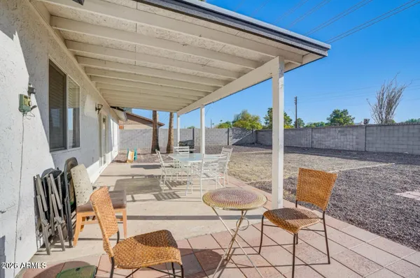 a view of an outdoor dining space with a patio