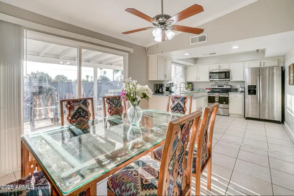 a view of a dining room with furniture window and outside view