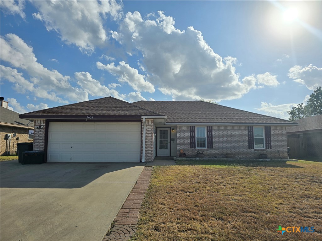2004 Basalt Drive Killeen, TX 76549 - Photo 1 of 28 a front view of a house with a yard and garage