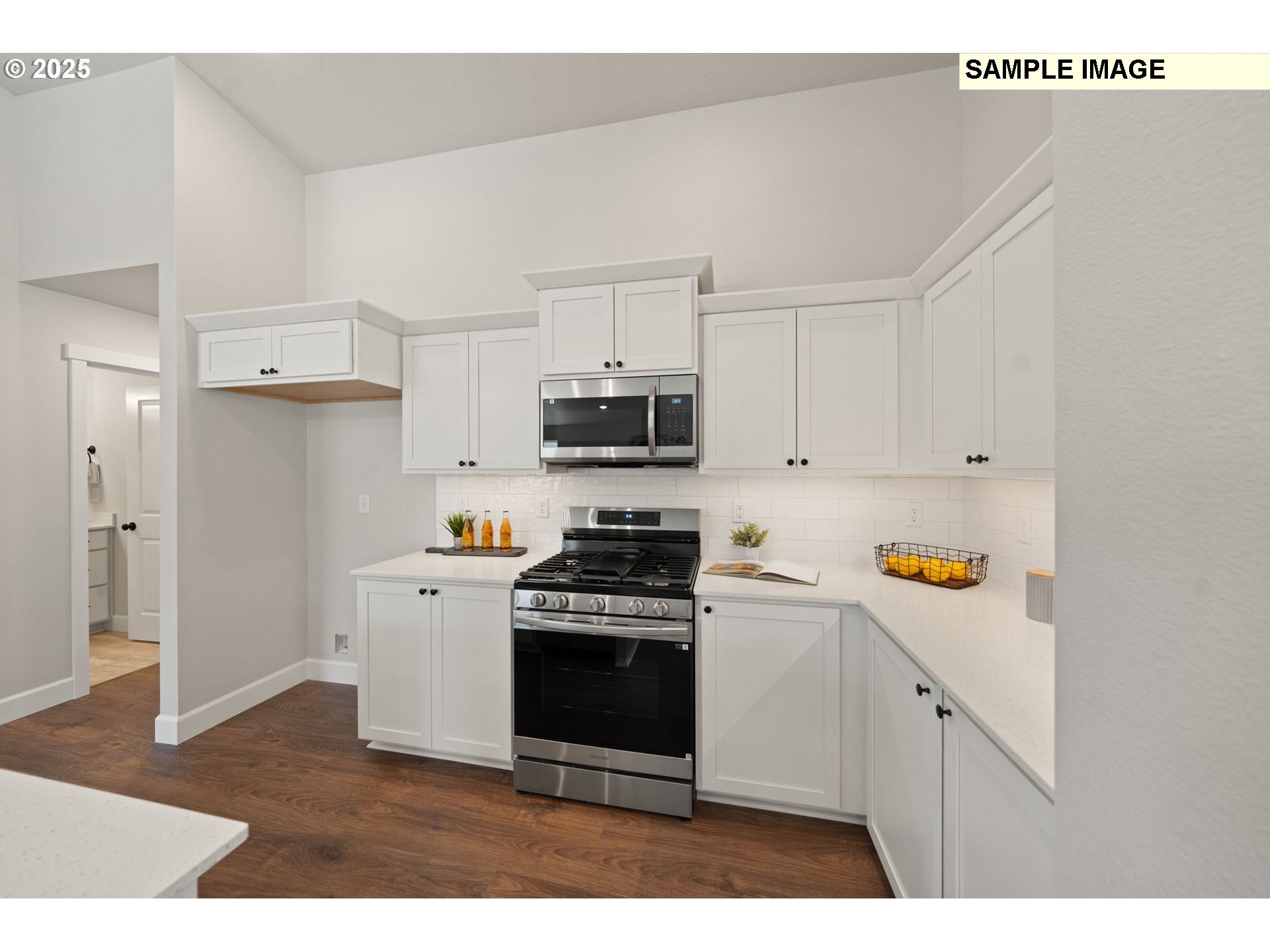562 Taft Street Umatilla, OR 97882 - Photo 11 of 28 a kitchen with stainless steel appliances granite countertop a stove a sink and a refrigerator