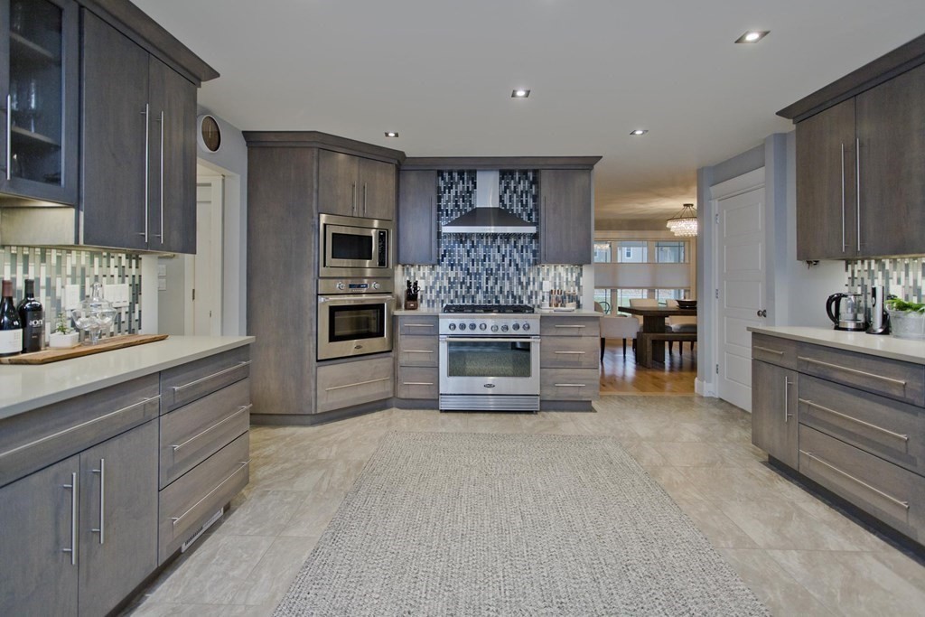 102 Linden Ridge Road Amherst, MA 01002 - Photo 3 of 42 a large kitchen with stainless steel appliances kitchen island granite countertop a large counter top stainless steel appliances and cabinets