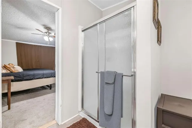 a bathroom with a shower and a sink