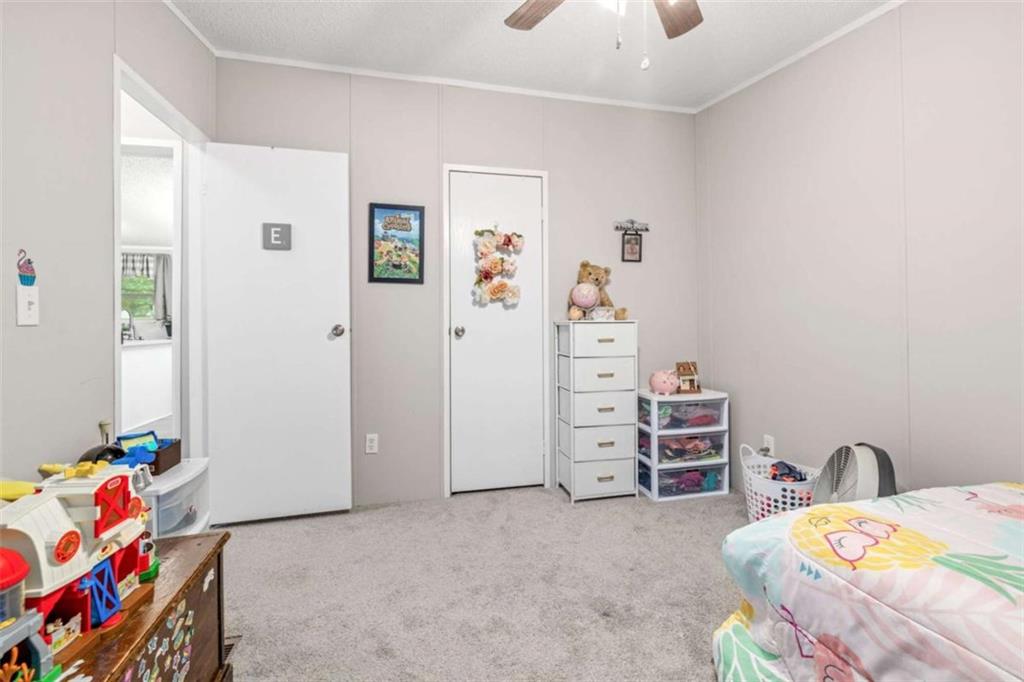 126 Loggins Trail Commerce, GA 30529 - Photo 27 of 50 a bedroom with a bed and furniture