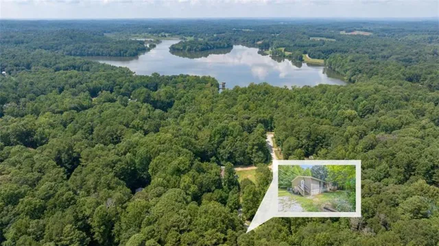 an aerial view of a house with lots of trees