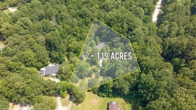 a view of a sign under a tree