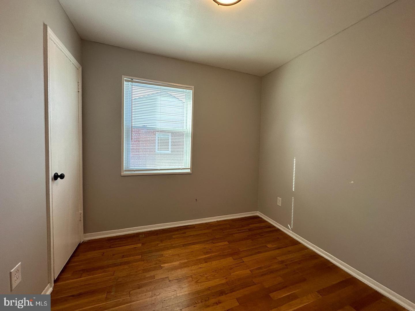 4116 Duke Street Alexandria, VA 22304 - Photo 12 of 16 an empty room with wooden floor and windows