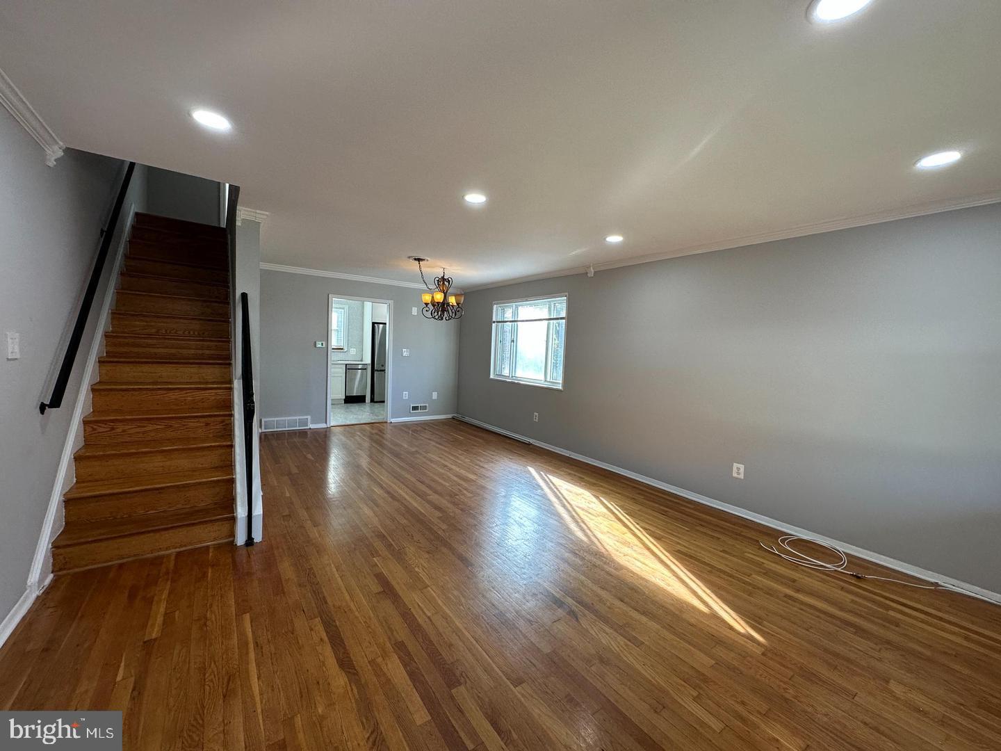 4116 Duke Street Alexandria, VA 22304 - Photo 2 of 16 an empty room with wooden floor and windows