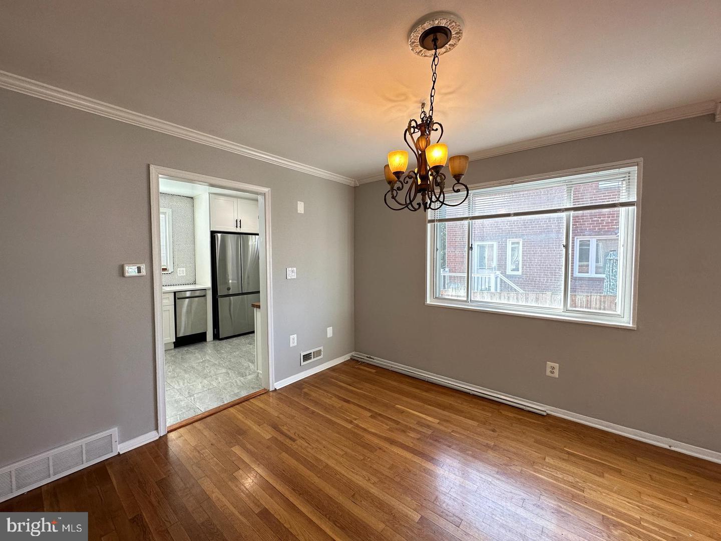 4116 Duke Street Alexandria, VA 22304 - Photo 4 of 16 a very nice looking room with a chandelier fan and windows