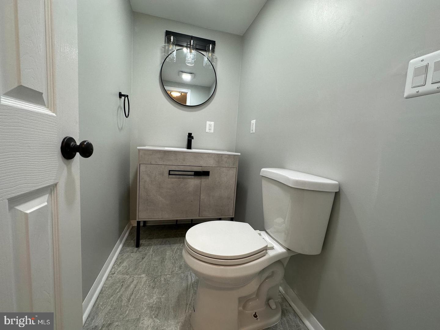 4116 Duke Street Alexandria, VA 22304 - Photo 6 of 16 a bathroom with a toilet and a mirror