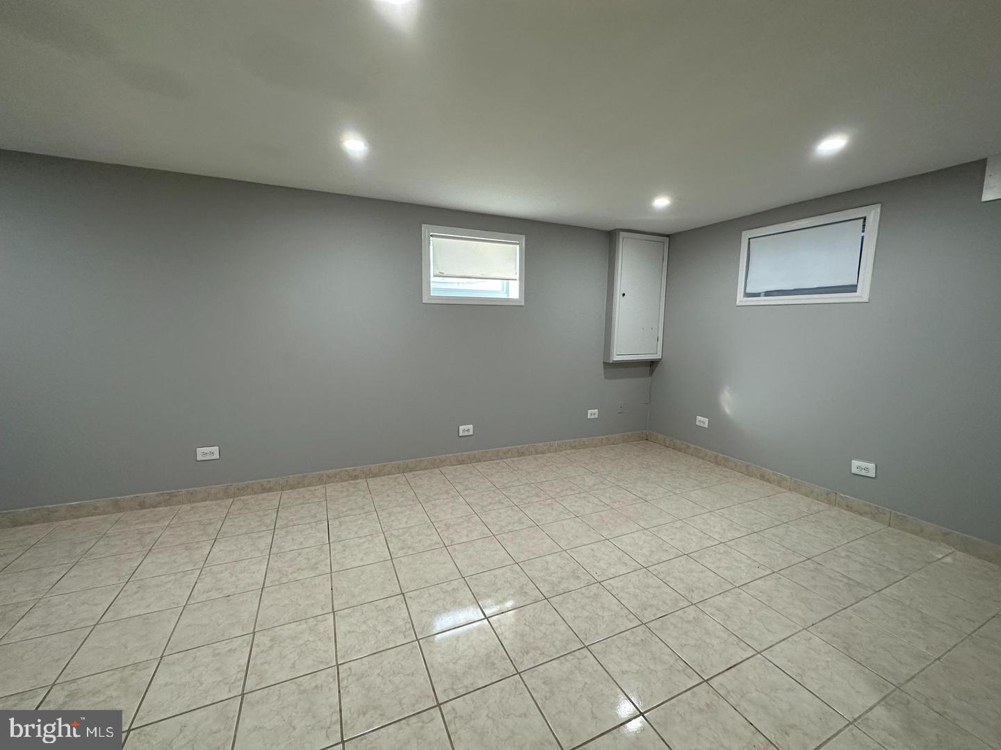 4116 Duke Street Alexandria, VA 22304 - Photo 7 of 16 an empty room with white walls and tiles