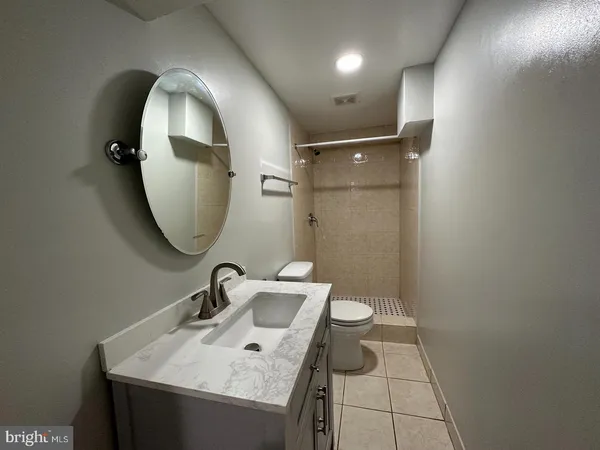 a bathroom with a sink and mirror
