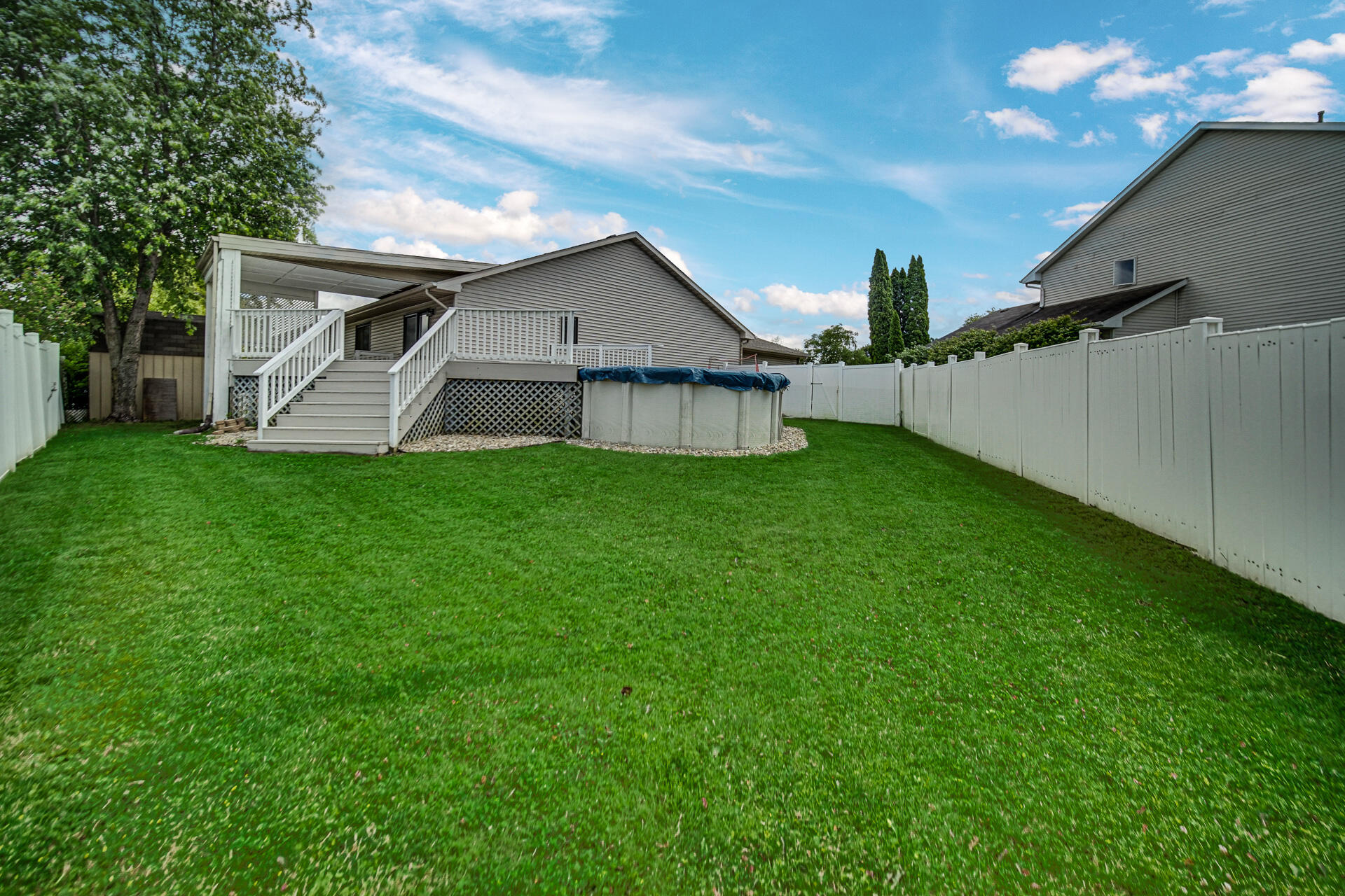 4942 West 93rd Court Crown Point, IN 46307 - Photo 33 of 37 a view of a house with a yard and deck