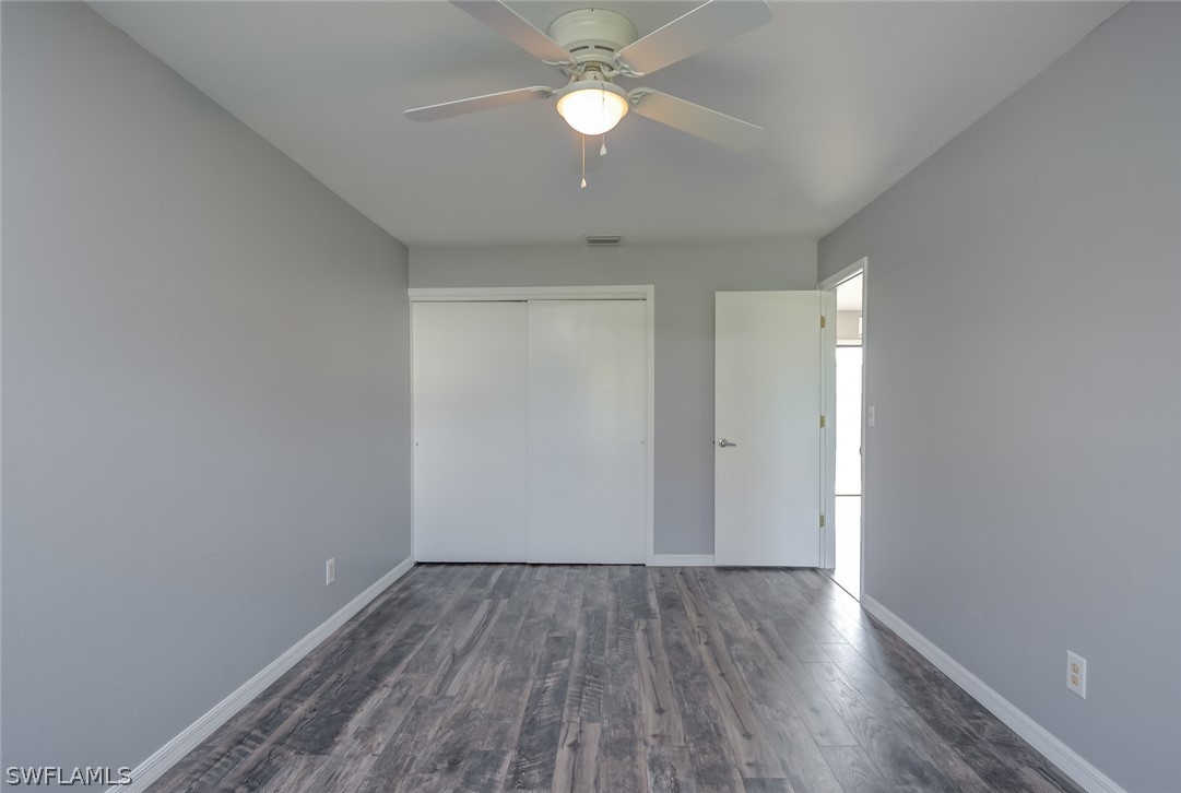 18485 Sebring Road Fort Myers, FL 33967 - Photo 11 of 21 a view of empty room with wooden floor