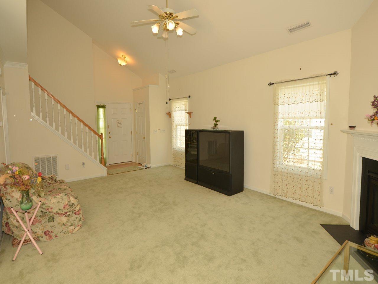335 Inkster Cove Raleigh, NC 27603 - Photo 5 of 25 a view of livingroom with hardwood floor and a ceiling fan