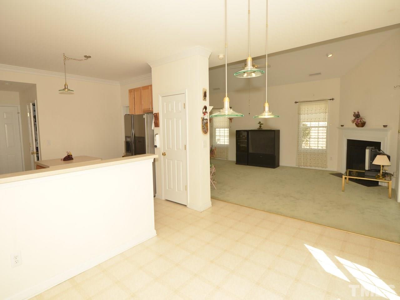 335 Inkster Cove Raleigh, NC 27603 - Photo 8 of 25 a view of a kitchen and a kitchen
