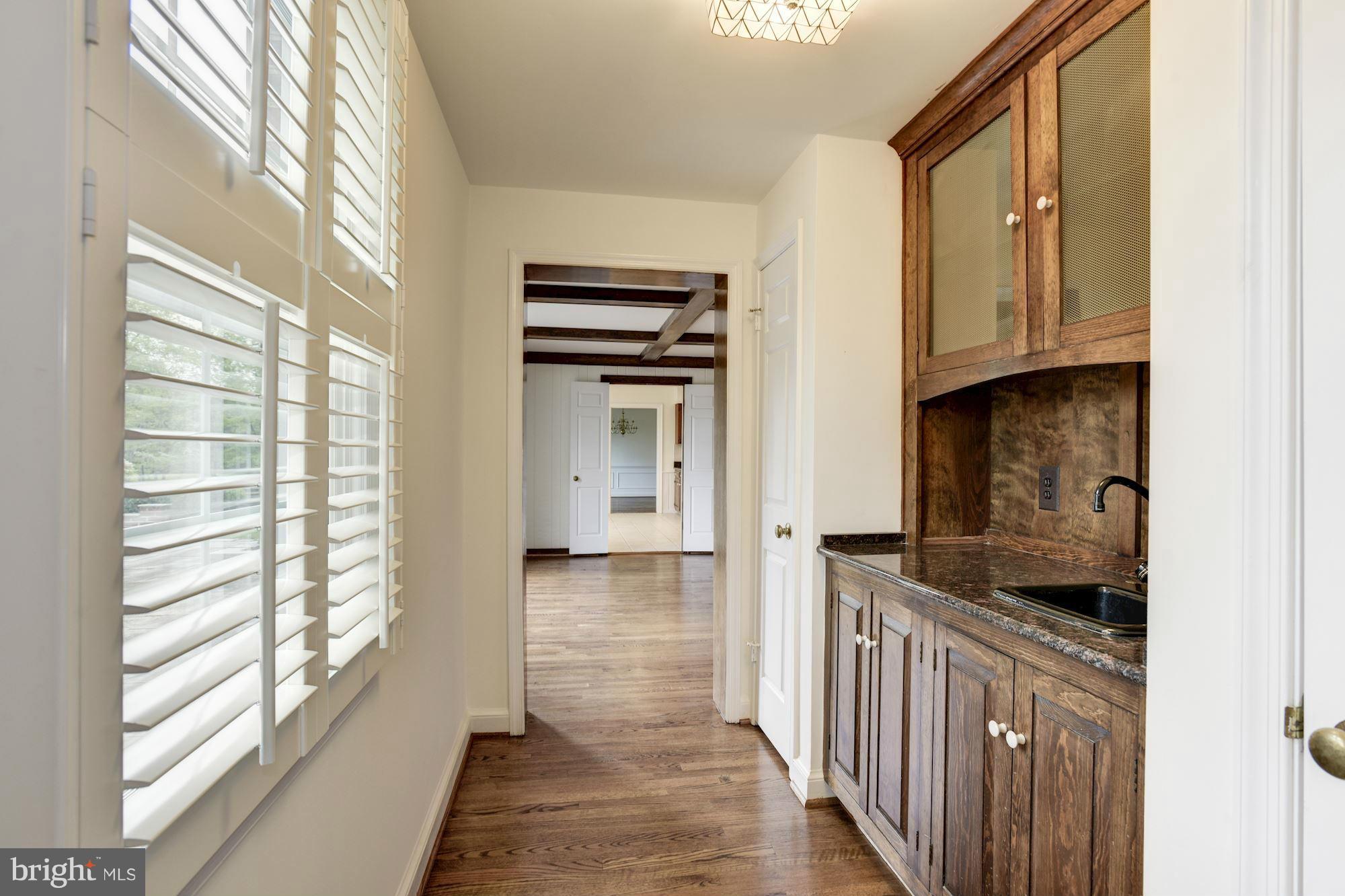 13605 Query Mill Road North Potomac, MD 20878 - Photo 10 of 30 Hallway with Wet Bar to Mud Room