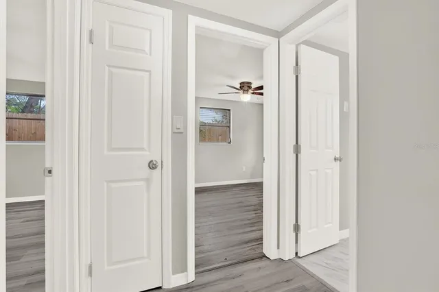 an empty room with wooden floor and closet