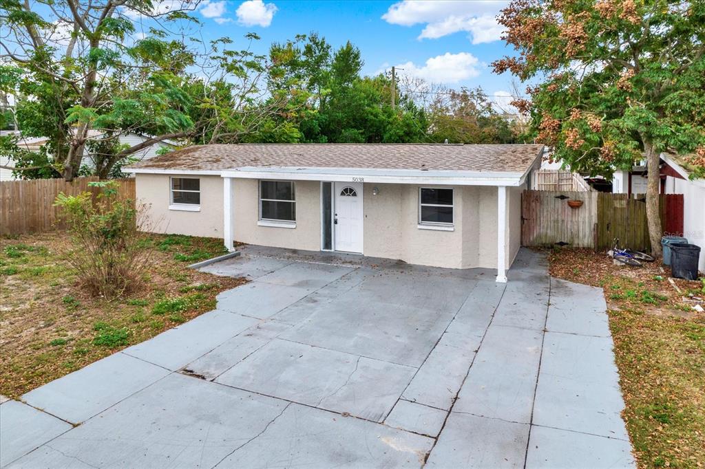 5038 Galaxy Drive New Port Richey, FL 34652 - Photo 27 of 32 a view of a house with a yard