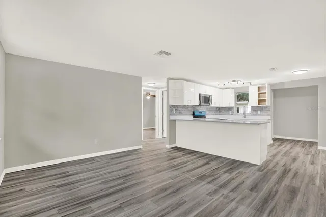 a view of kitchen with wooden floor