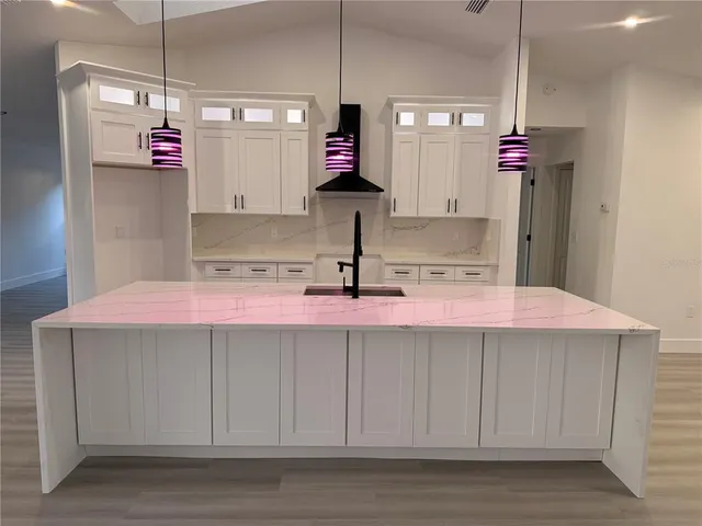 a storage room with kitchen view