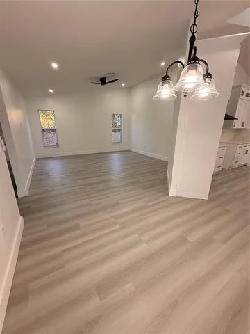 a view of a livingroom with wooden floor
