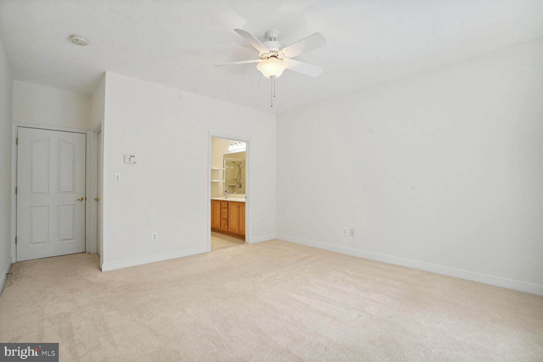 13037 Ormond Drive Bristow, VA 20136 - Photo 16 of 36 Primary bedroom has an ensuite & a ceiling fan.