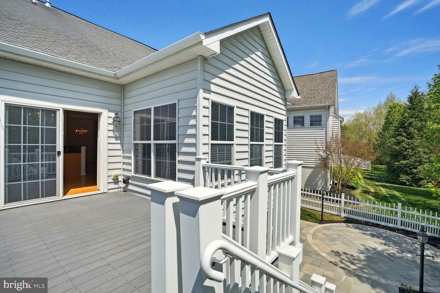 13037 Ormond Drive Bristow, VA 20136 - Photo 31 of 36 Trex deck with stairs down to stone patio.